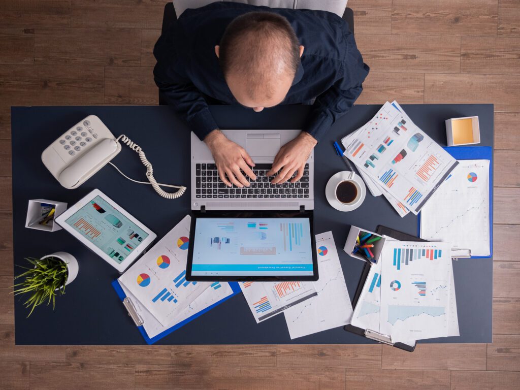 Top view of business man using merchandising planning tools